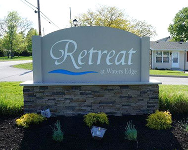 Retreat at Waters Edge sign